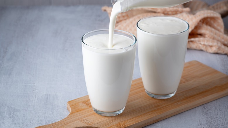 Pouring buttermilk in glass