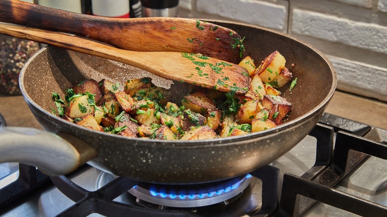 Potatoes in stovetop pan 