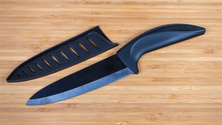 Kitchen knife with a guard