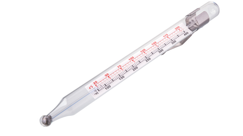 glass candy thermometer white background