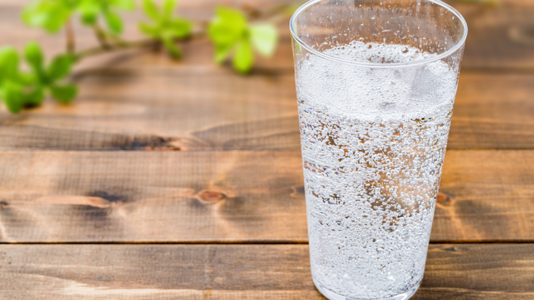 Seltzer water on wooden background