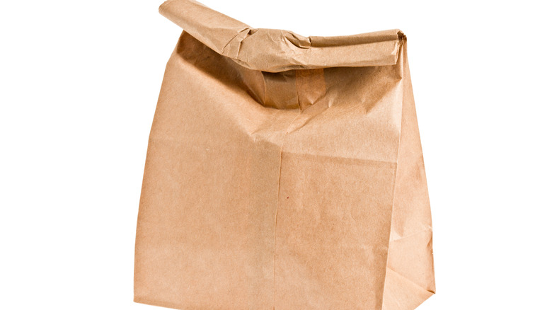 Brown lunch bag white background