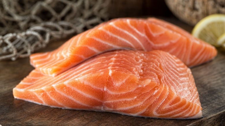 Fresh raw salmon on cutting board