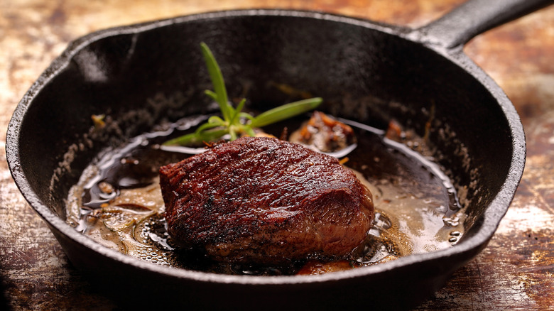 Cooking steak on skillet