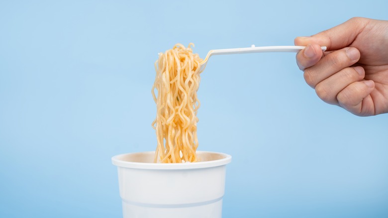 Instant noodles on blue background