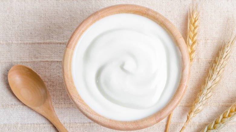 Yogurt in wooden bowl