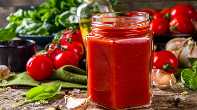 Sauce in jar with ingredients