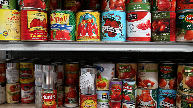 Canned tomatoes on shelf