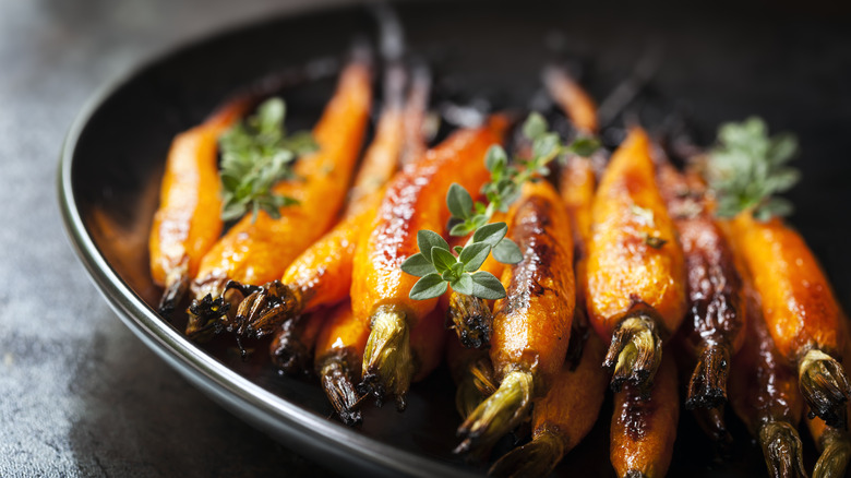 Roasted baby carrots in plate 