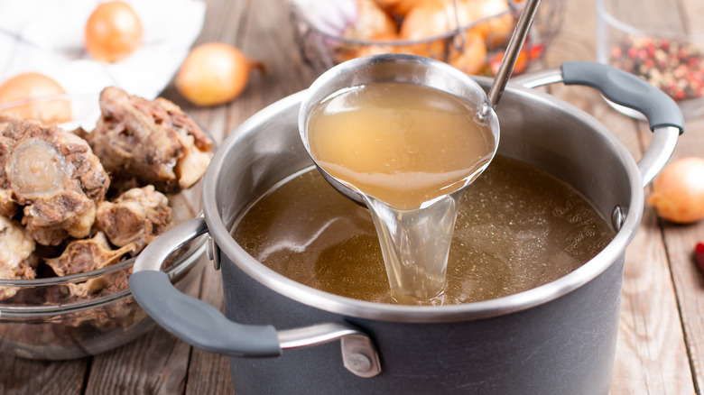 Pot of stock and ladle 