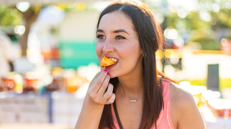 Person eating at farmers' market