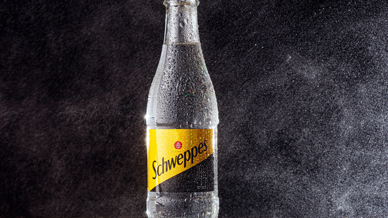 Glass bottle of Schweppes