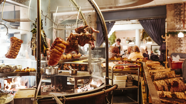 meat cooked over fire pit in restaurant