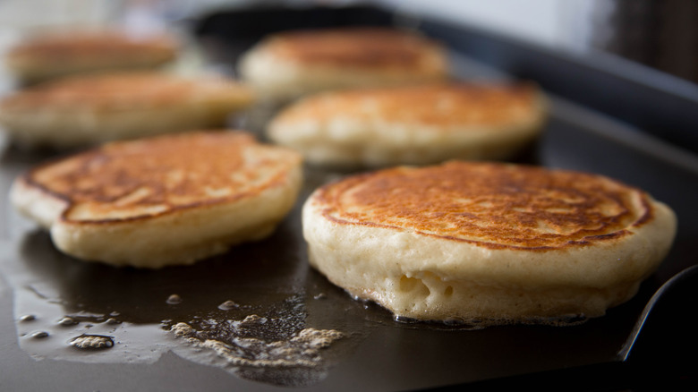 fluffy pancakes on griddle