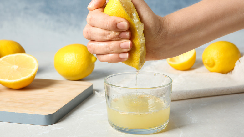 squeezing fresh lemon juice