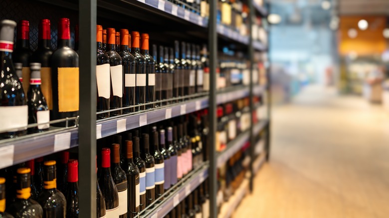 Wine bottles on shelves in a wine shop