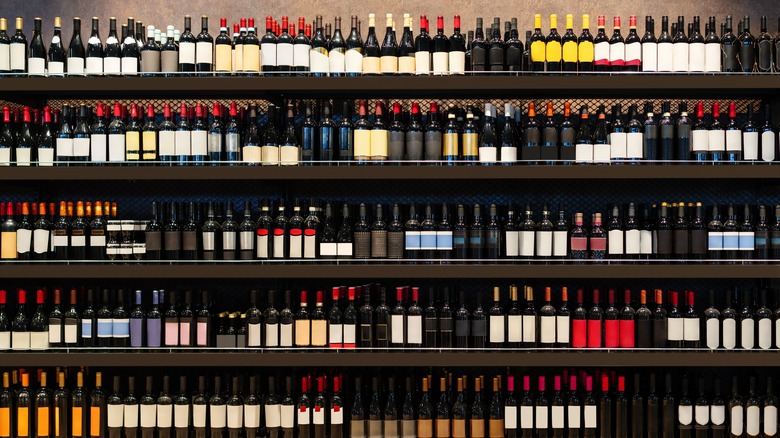 Wine bottles on shelves in a liquor store