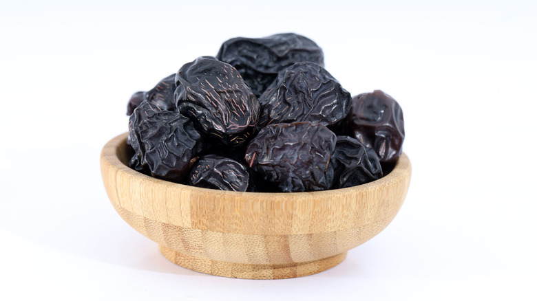 Ajwa dates in wood bowl