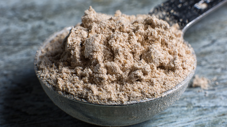 Measuring spoon with barley flour 