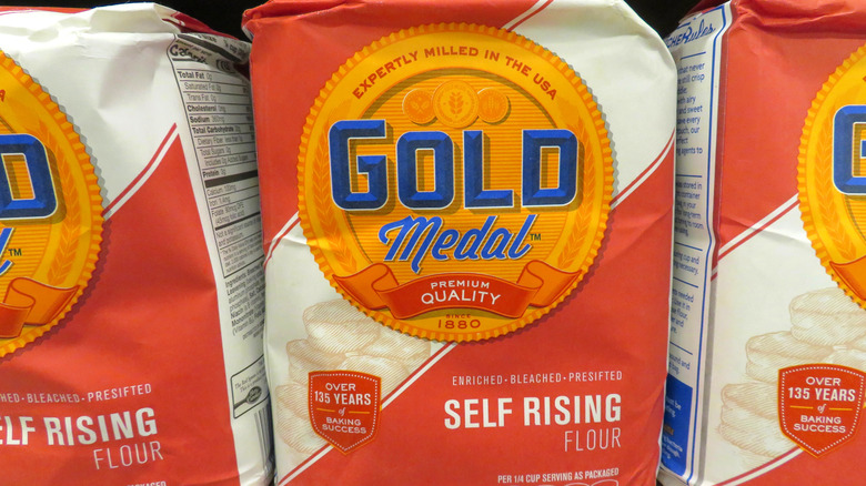 Sacks of self rising flour on shelf 