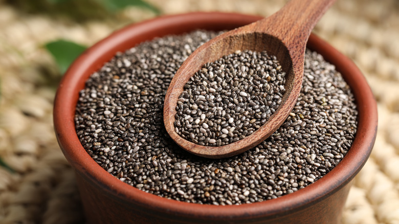 Dark chia seeds in bowl