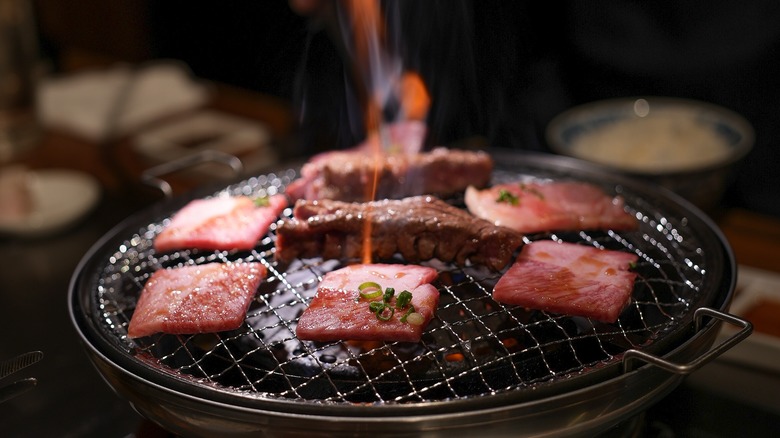 Wagyu slices being grilled in a yakiniku restaurant