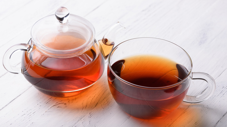 black tea in glass teapot