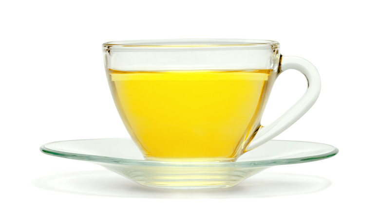 Yellow tea on saucer