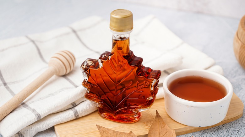 Bottle and bowl of maple syrup