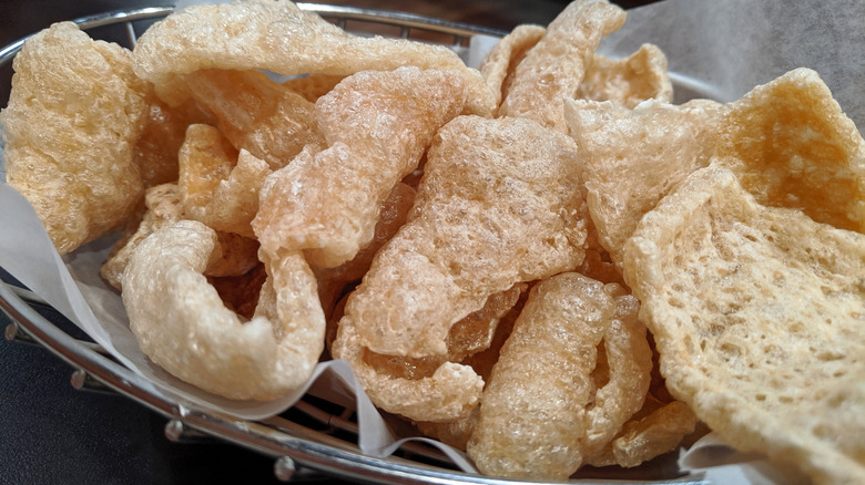 Chicharrones in basket with parchment paper