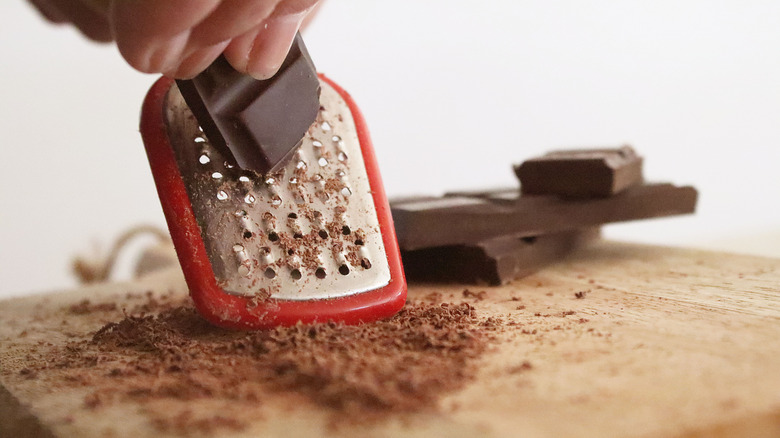 Chocolate shavings on cutting board
