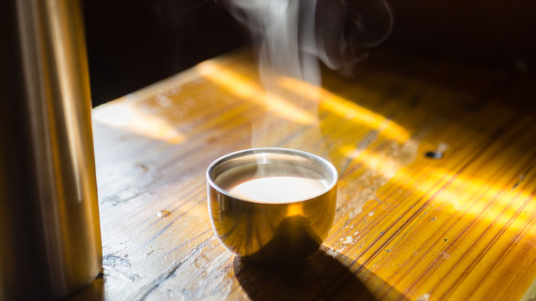 Tibetan yak butter tea on wooden table