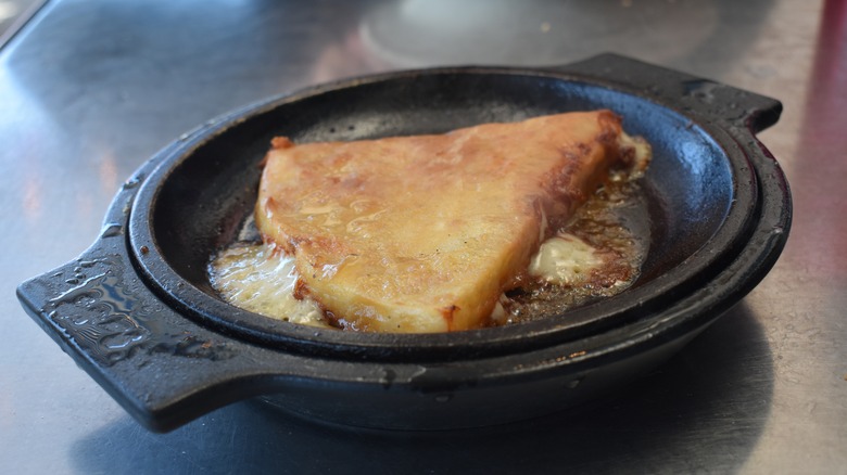 Flaming saganaki in cast iron