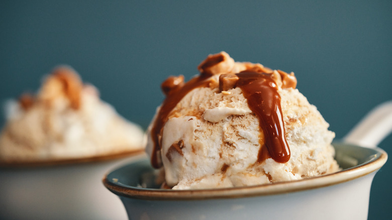 Ice cream in bowl with caramel sauce