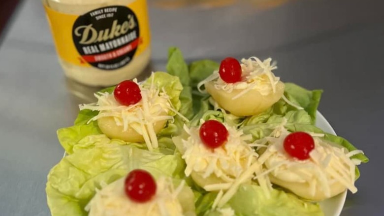 Platter of pears with cherry, mayo, and cheese and jar of Duke's mayo in the background