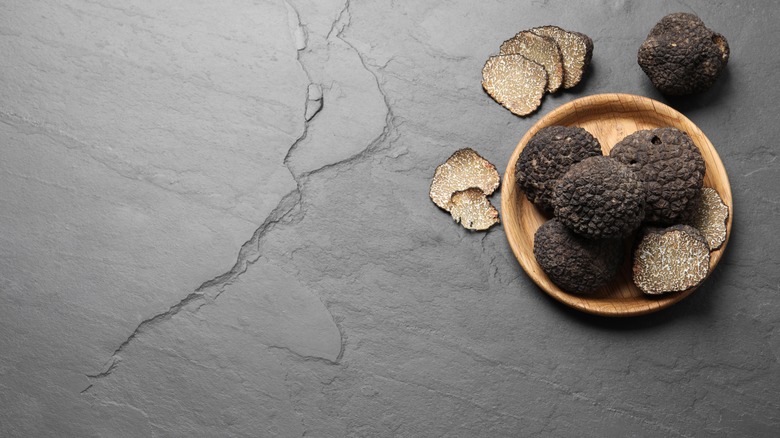Black truffles in bowl
