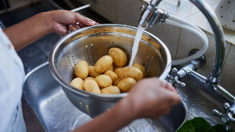 potatoes in bowl with water