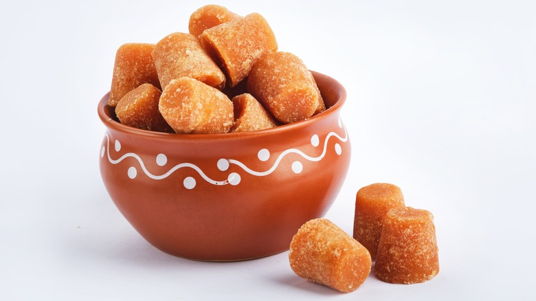 Jaggery cubes in clay pot