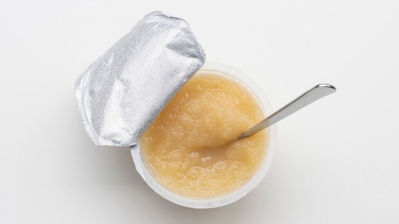 Unsweetened applesauce with spoon
