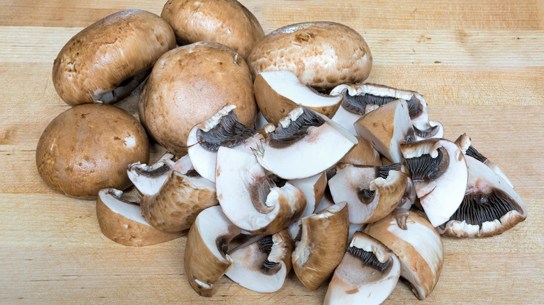 Sliced mushrooms on wood