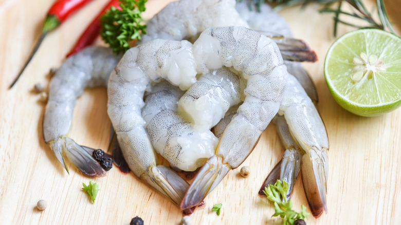 raw shrimp on a board