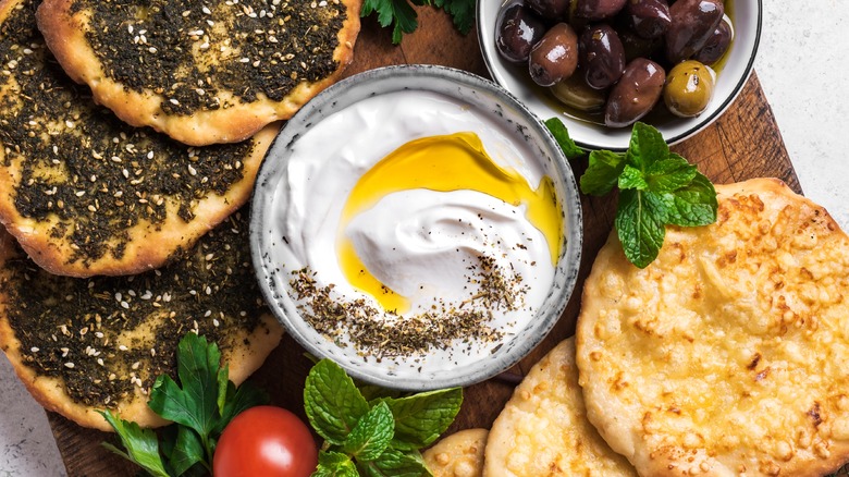 bowl of yogurt with za'tar and olives