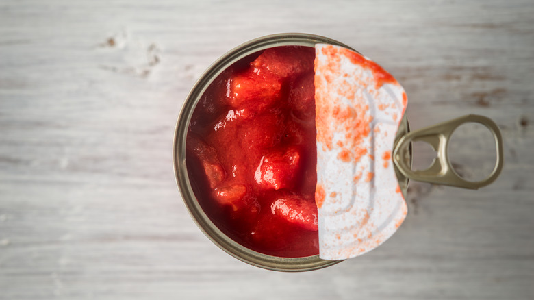 Canned tomatoes with lid open