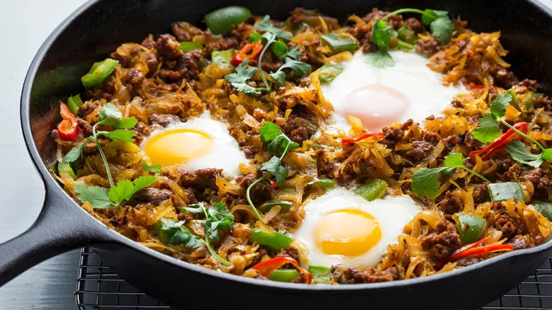 Chorizo hash and eggs in pan