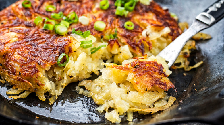 Swiss potato rösti﻿ topped with spring onions