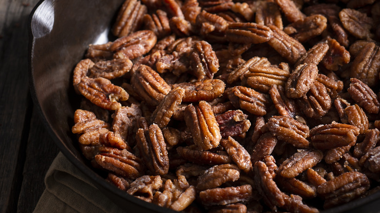 skillet full of candied pecans