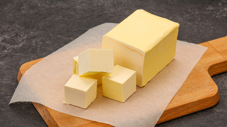 cubed butter on cutting board