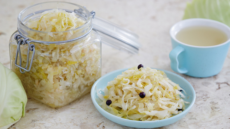 jarred and plated sauerkraut with juniper berries