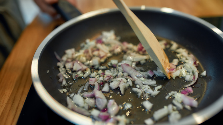 Sautéing aromatics in pan