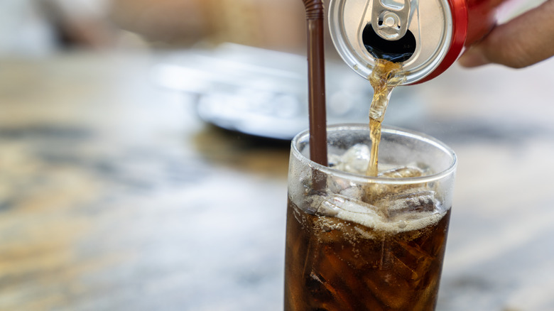 Cola being poured into a glass